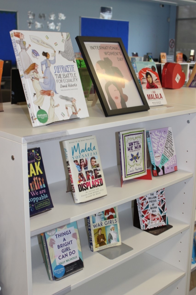 A close up photo of a selection of books by female authors celebrating International Women's Day at Victory Academy